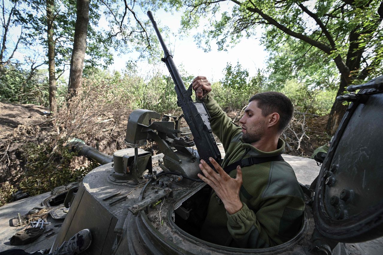 A Ukrainian artilleryman works on a self-propelled howitzer in the southern Mykolaiv region.